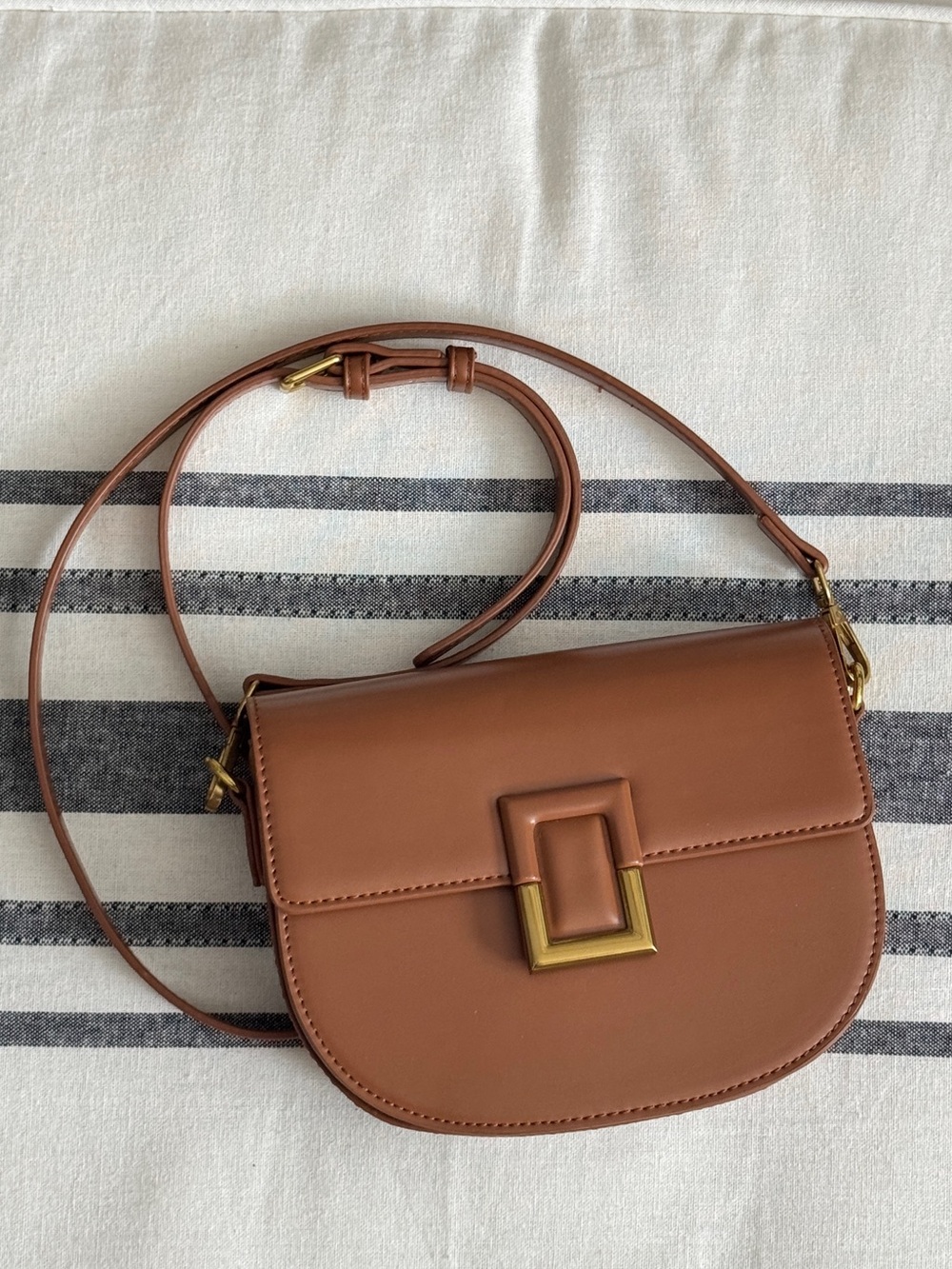 Classic Tan Leather Crossbody Saddle Bag with Gold Hardware
